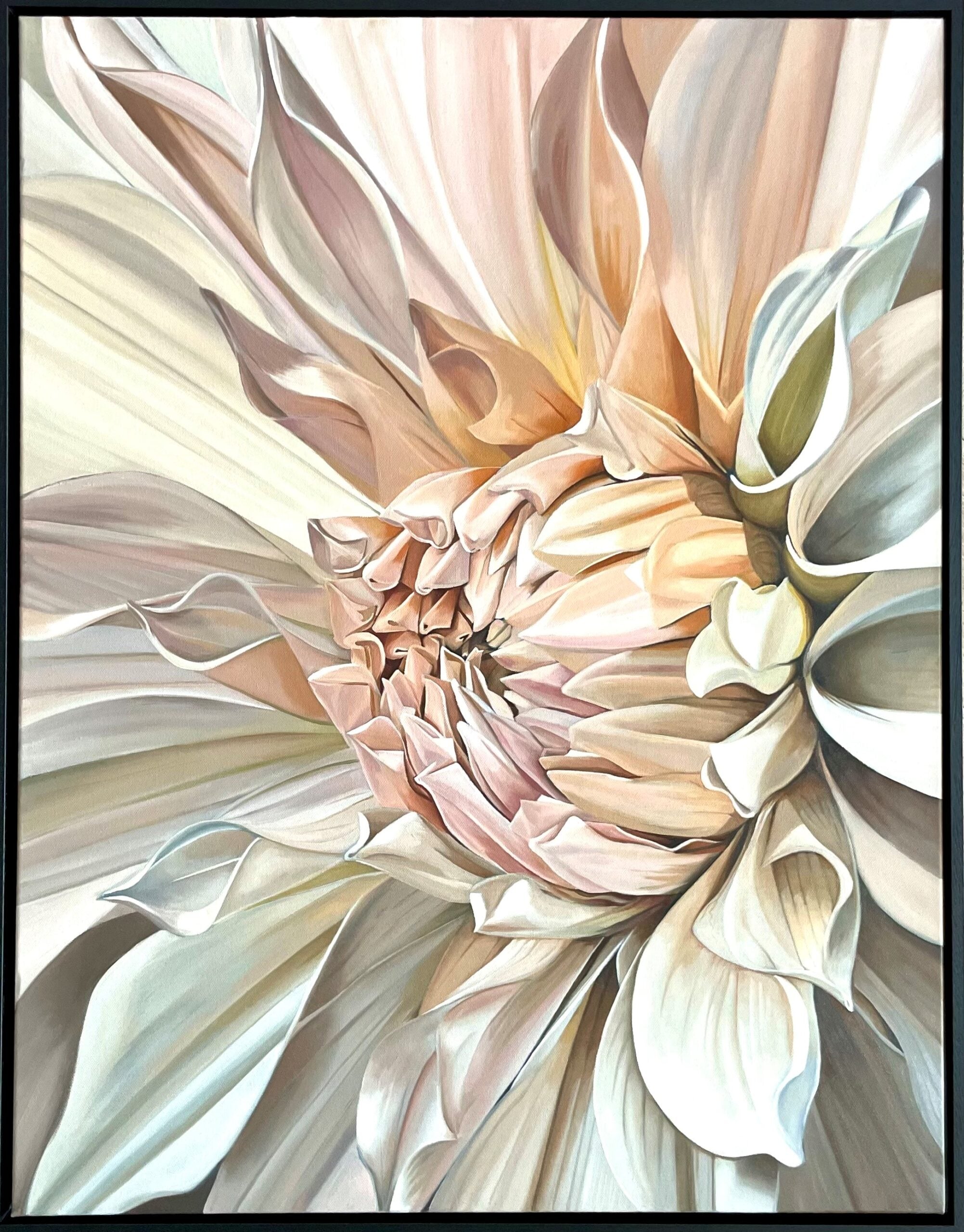 Close-up of a large, detailed flower with soft colors in a frame.