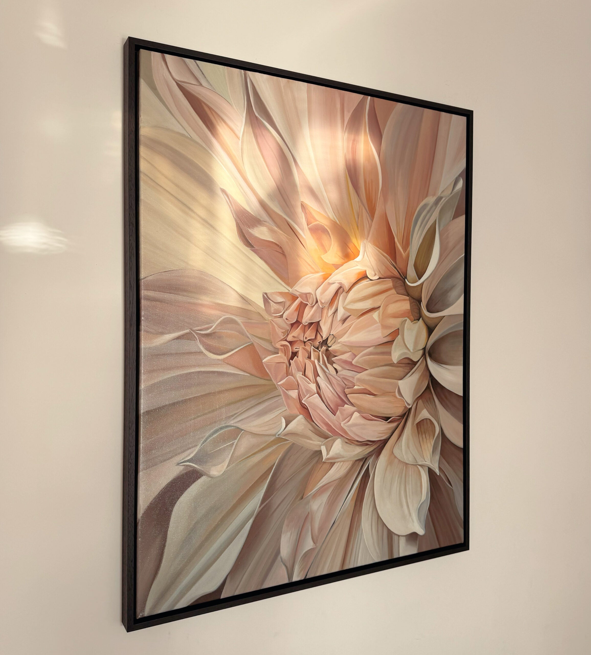 Framed artwork of a floral design on a beige wall